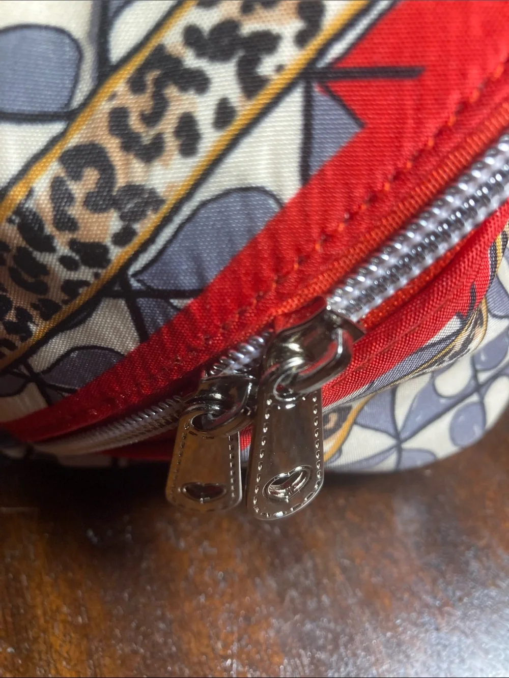 Brighton Wild Love cosmetic bag with bold leopard print and playful bow NWOT